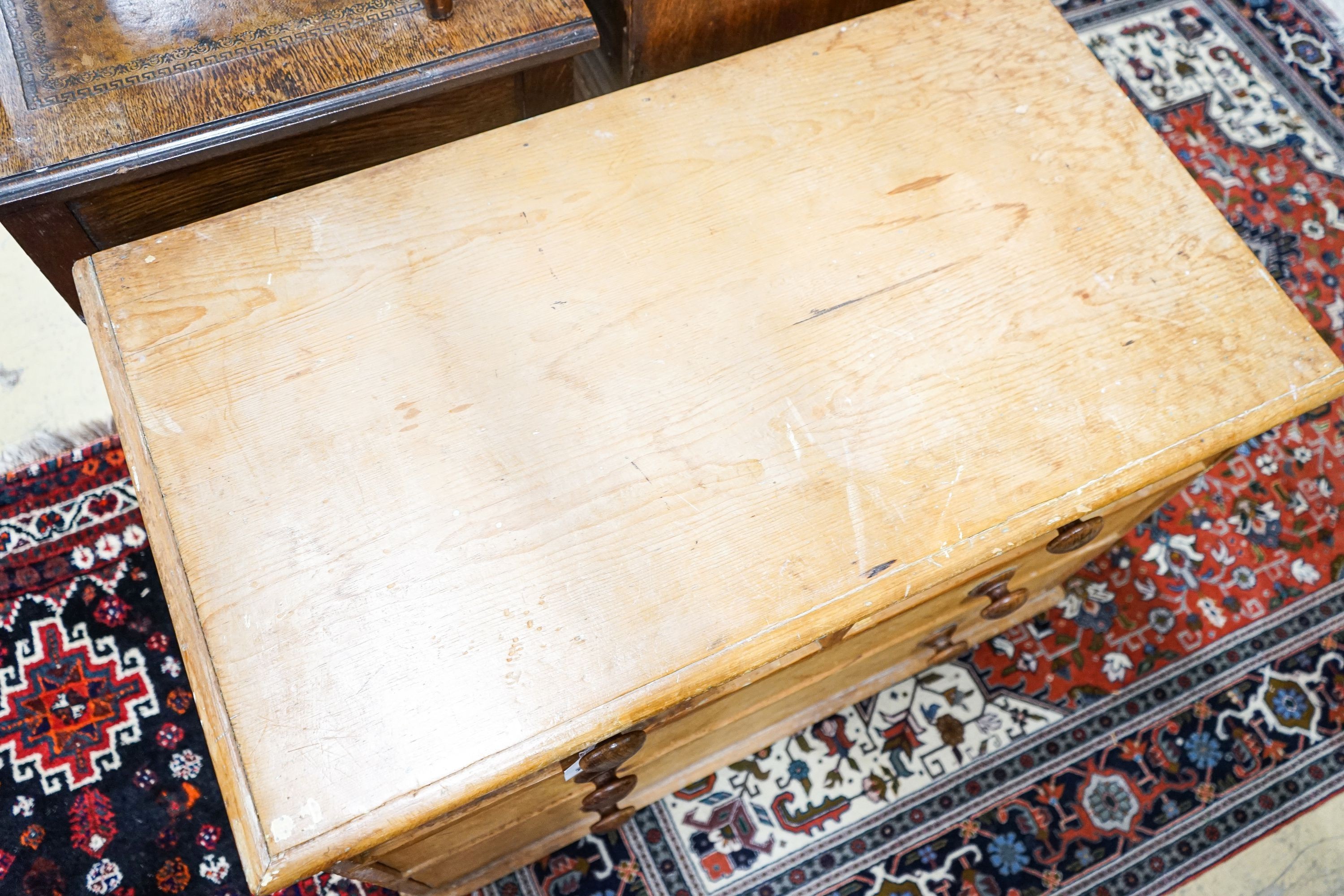 A Victorian stripped pine chest of drawers (lacking feet), width 94cm, depth 52cm, height 67cm